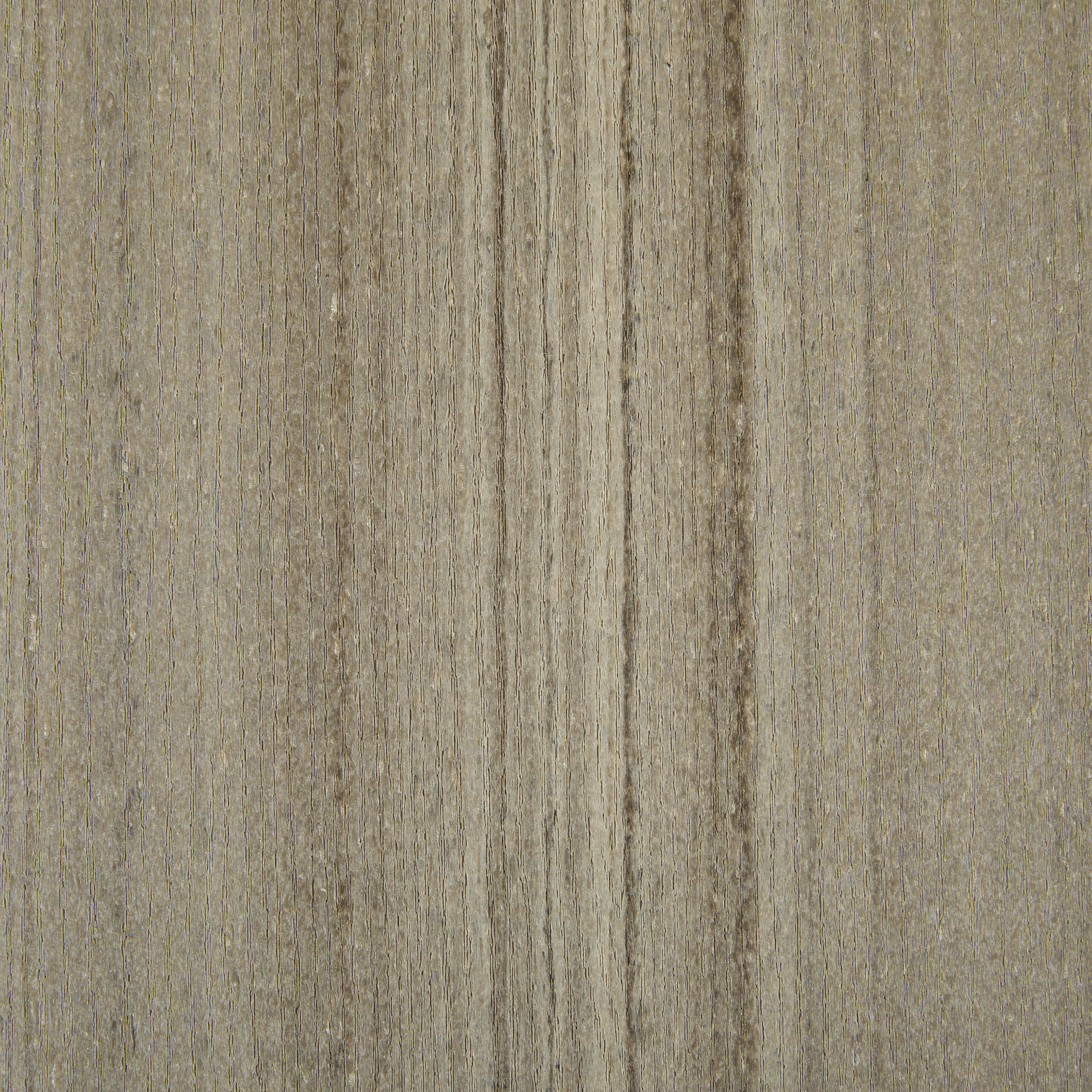 A swatch of Weathered Teak, featuring the soft, silvery-gray patina of aged coastal wood.