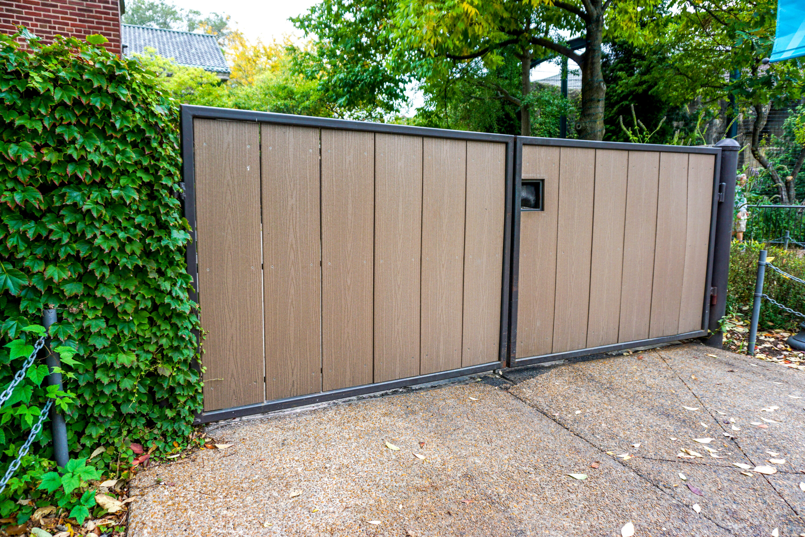 An HDPE privacy gate is installed at a commercial property entrance.